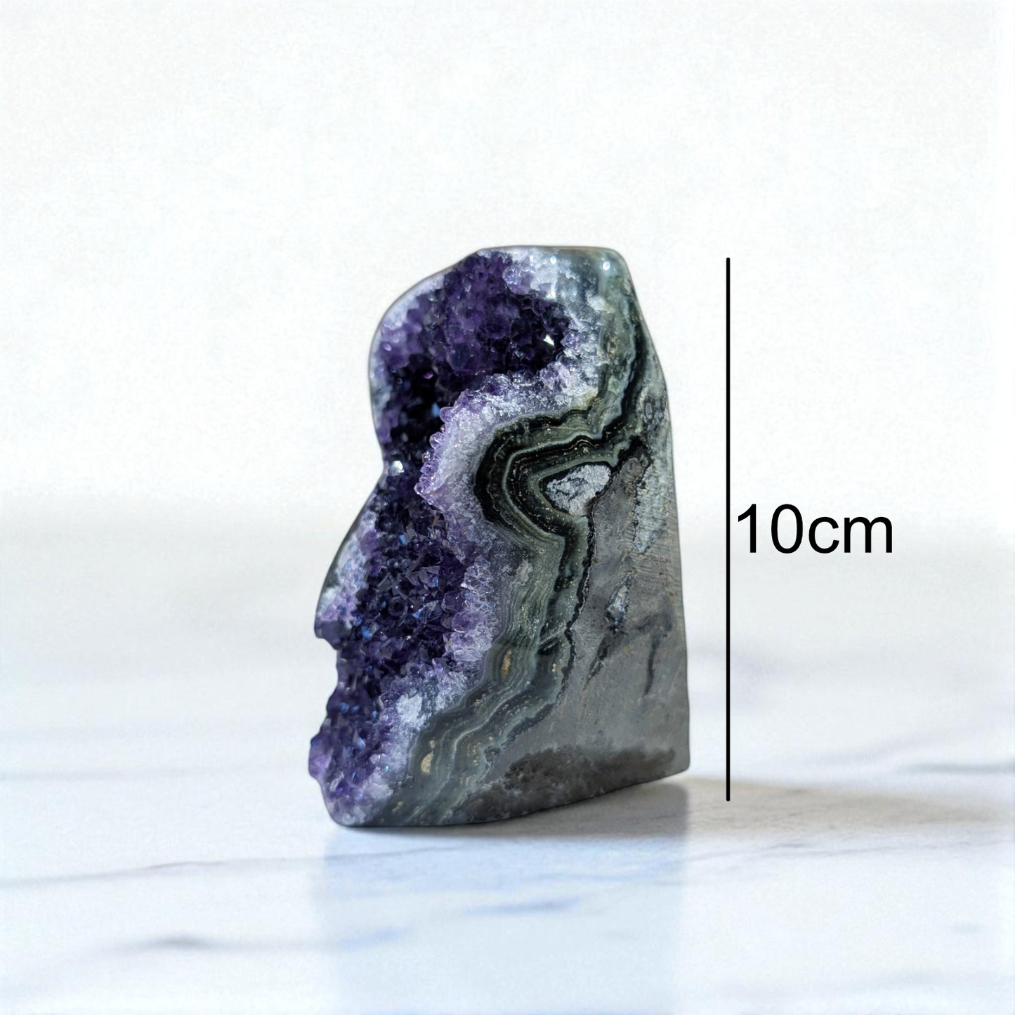 Amethyst - 10cm x 7cm on marble top with size