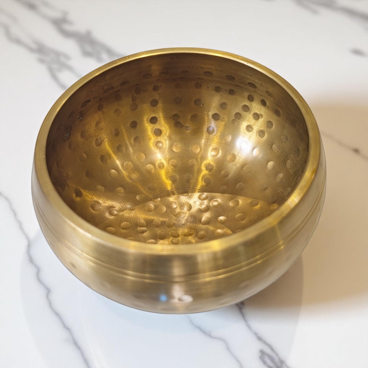 Hammered singing bowl