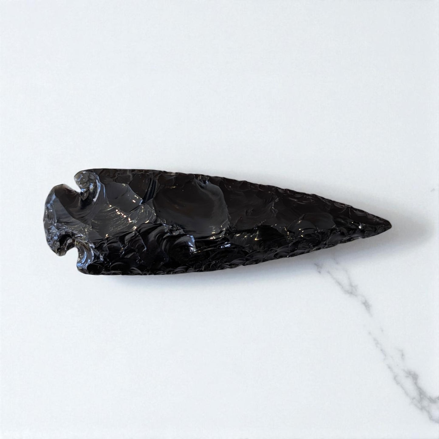 Black Obsidian Arrowhead - 13cm x 4cm on marble