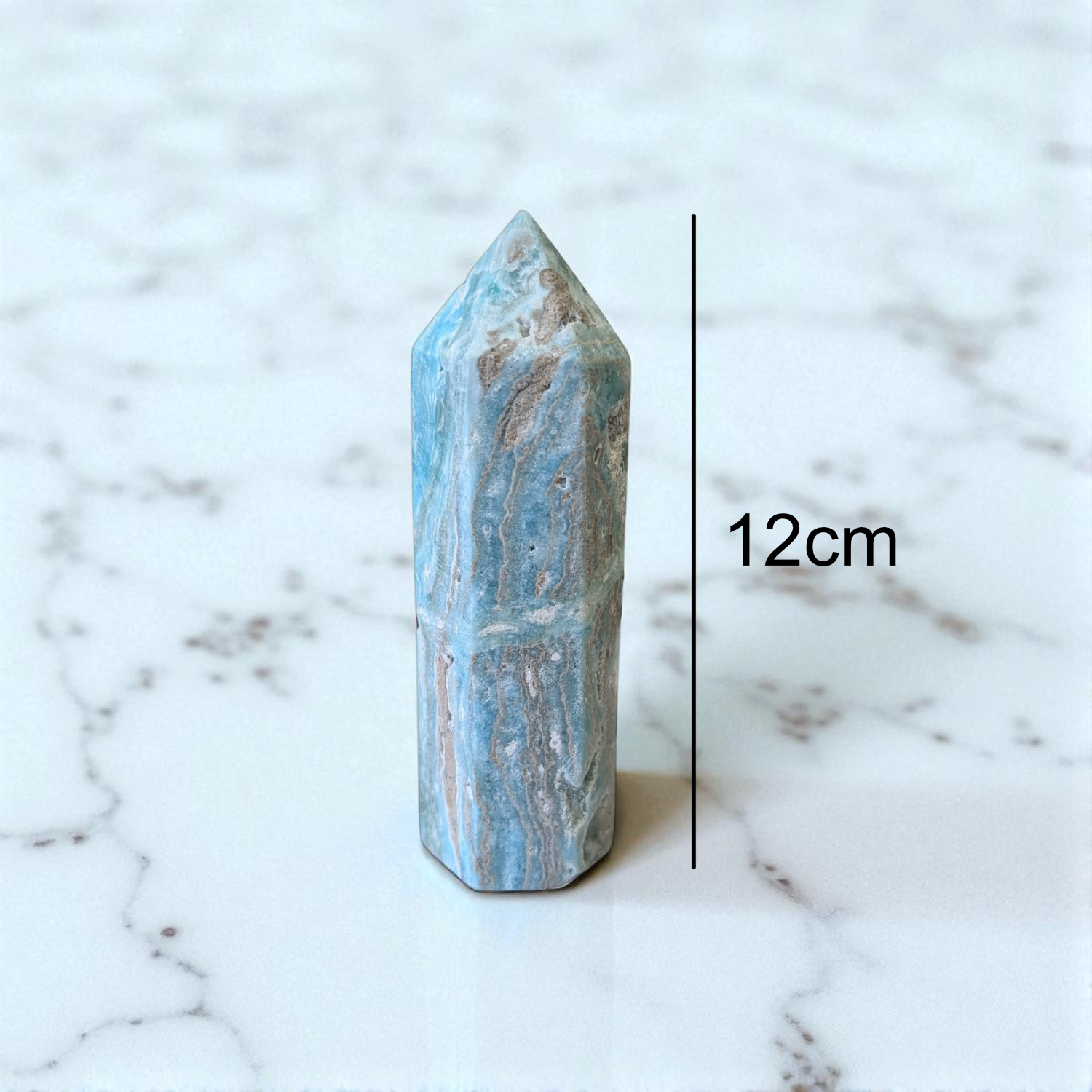 Caribbean Calcite Obelisk- 12 cm x 4cm on marble top with size