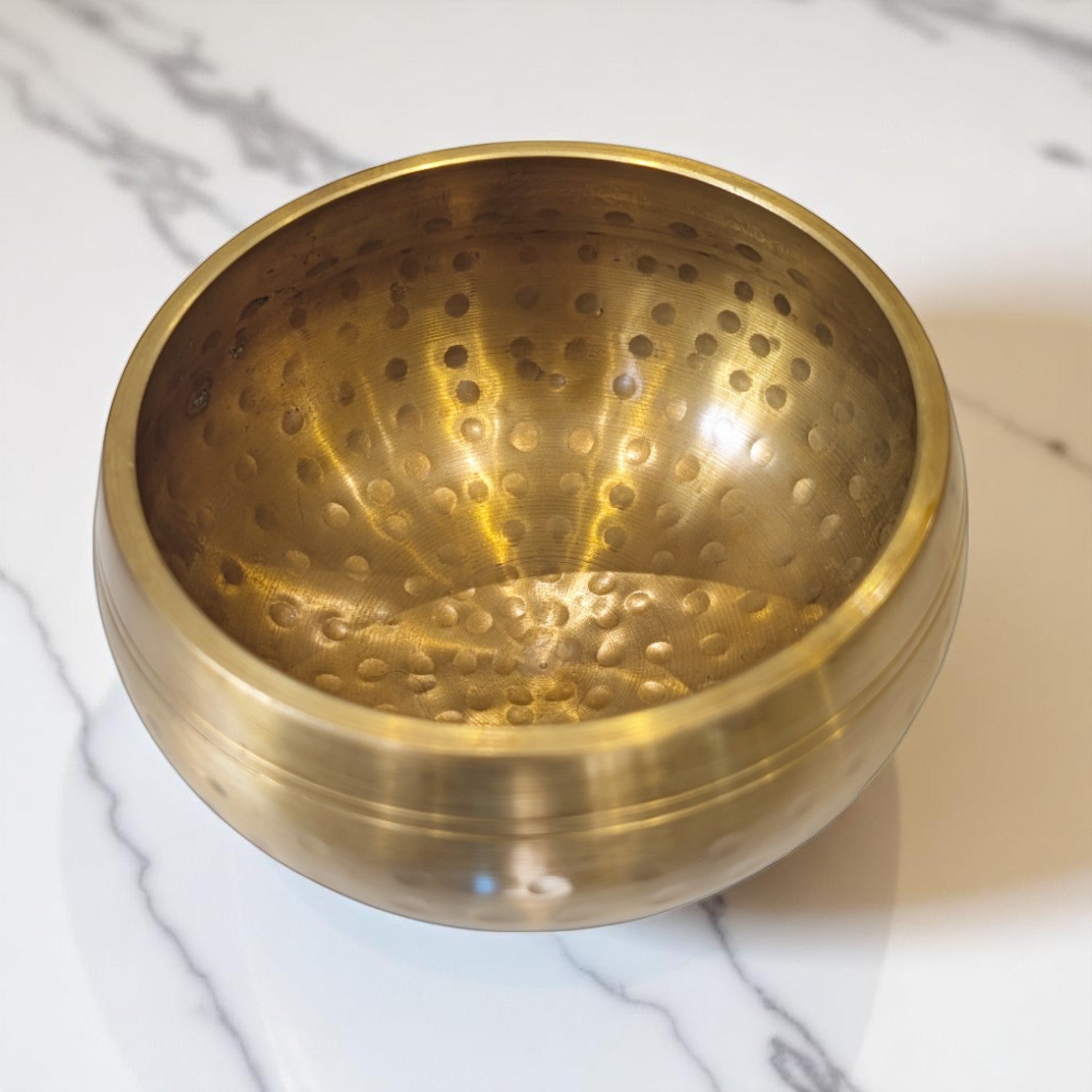Hammered singing bowl