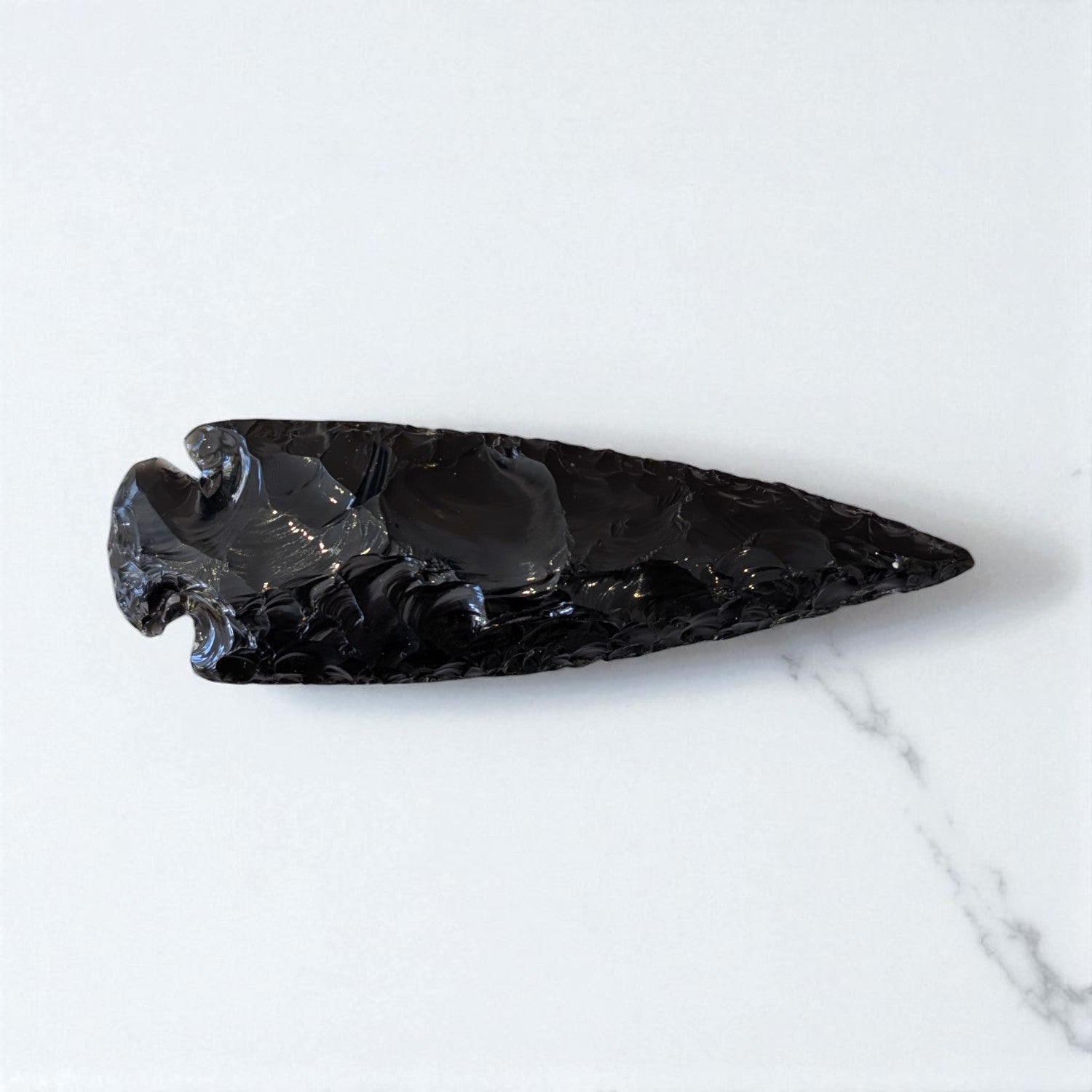 Black Obsidian Arrowhead - 13cm x 4cm on marble