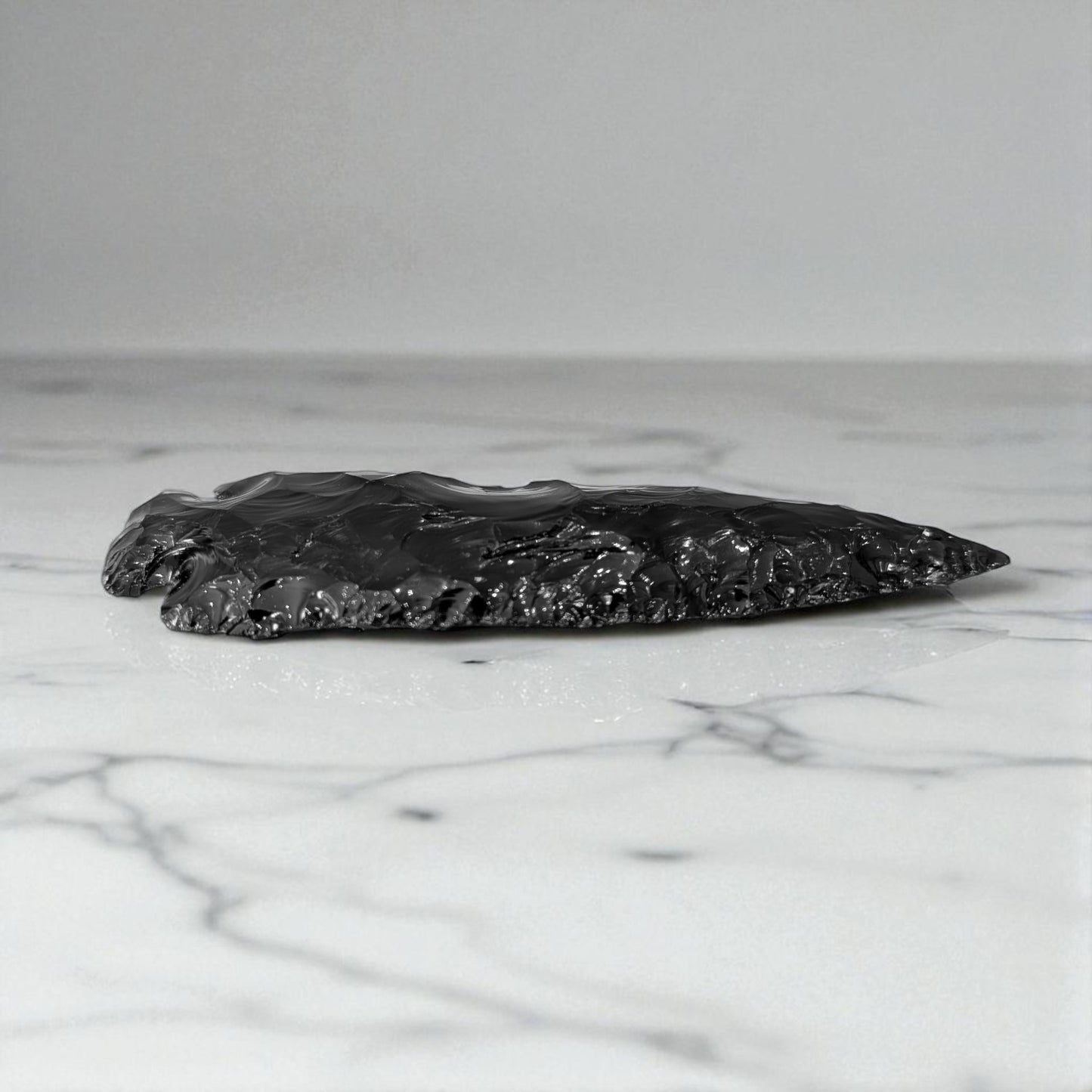 Black Obsidian Arrowhead - 13cm x 4cm on marble 2