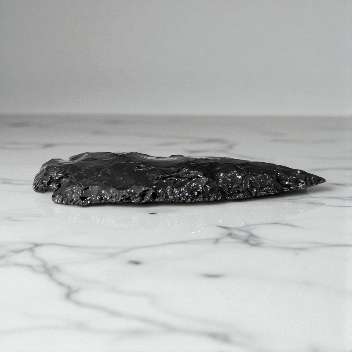 Black Obsidian Arrowhead - 13cm x 4cm on marble 2