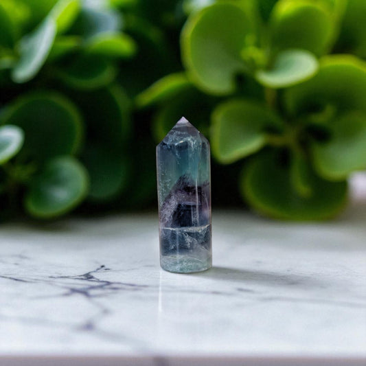 Rainbow Fluorite Obelisk - 7.5cm x 2.5cm on marble