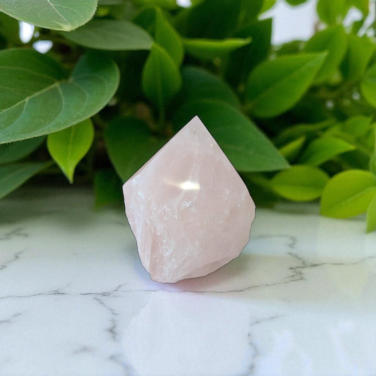 Rose Quartz Point - 8cm x 8cm on marble