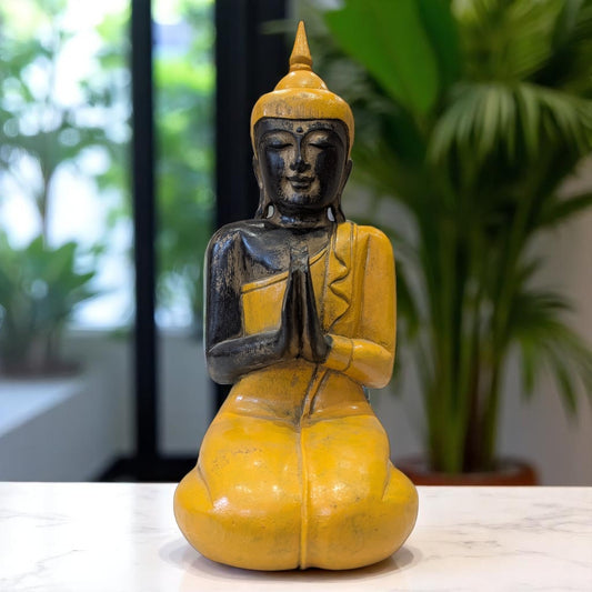 Carved wooden buddha yellow front with plants